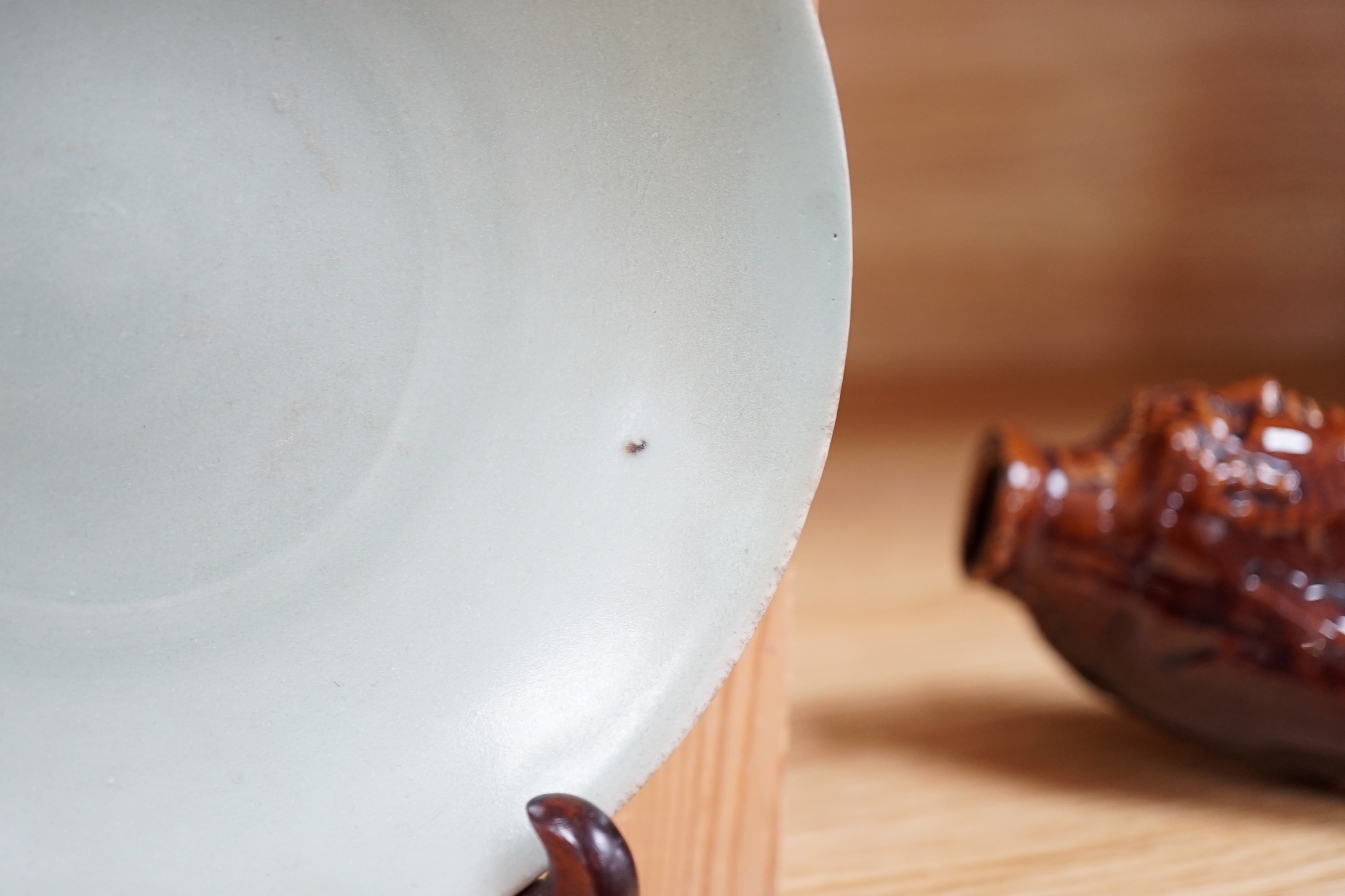 A Chinese Celadon dish and stand, 16cm diameter